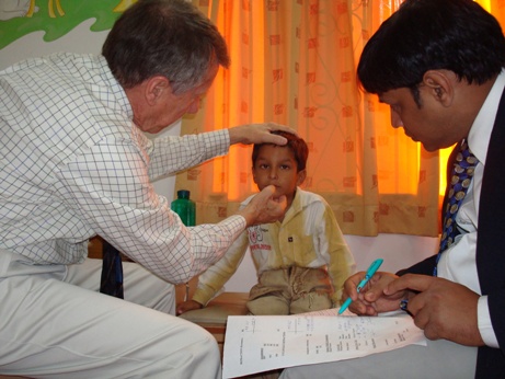 Dr. T.Otis Paul and dr Sudhir Singh evaluating a squint case